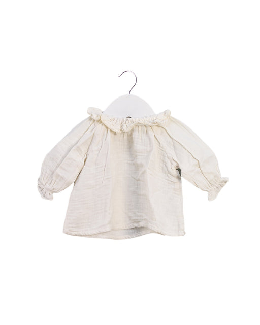 A Ivory Long Sleeve Tops from Bonton in size 0-3M for girl. (Front View)