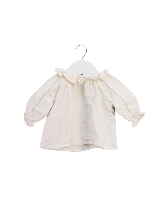 A Ivory Long Sleeve Tops from Bonton in size 0-3M for girl. (Front View)