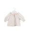 A Ivory Long Sleeve Tops from Bonton in size 0-3M for girl. (Front View)