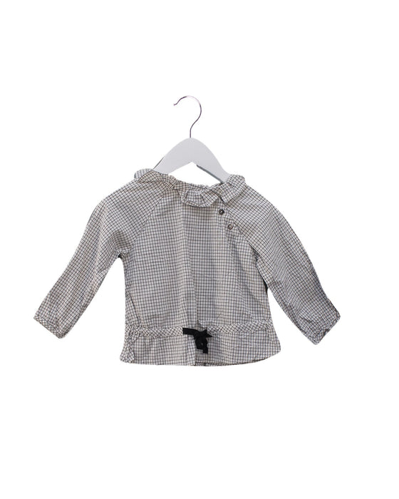 A Black Long Sleeve Tops from Jacadi in size 6-12M for girl. (Front View)