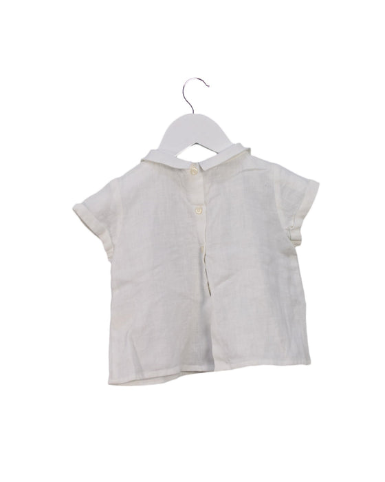 A White Short Sleeve Tops from Nanos in size 6-12M for girl. (Back View)