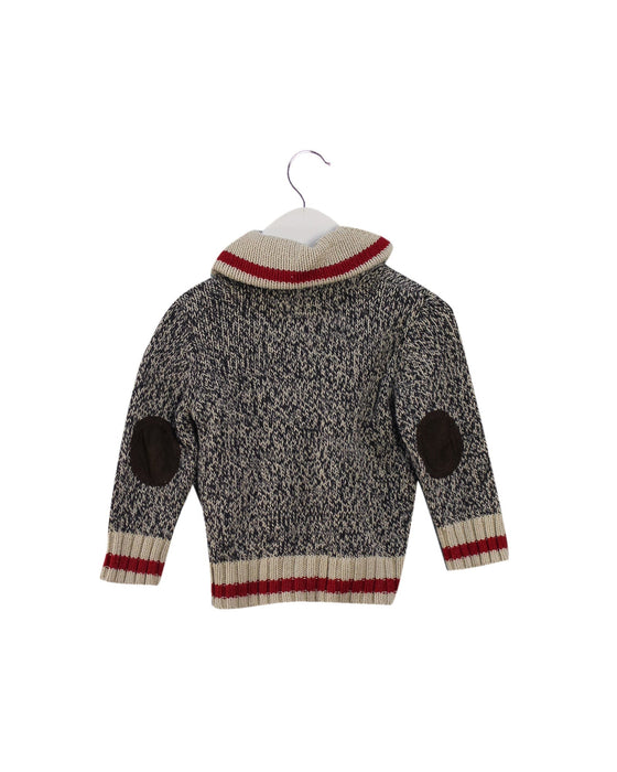 A Grey Lightweight Jackets from Roots in size 6-12M for girl. (Back View)