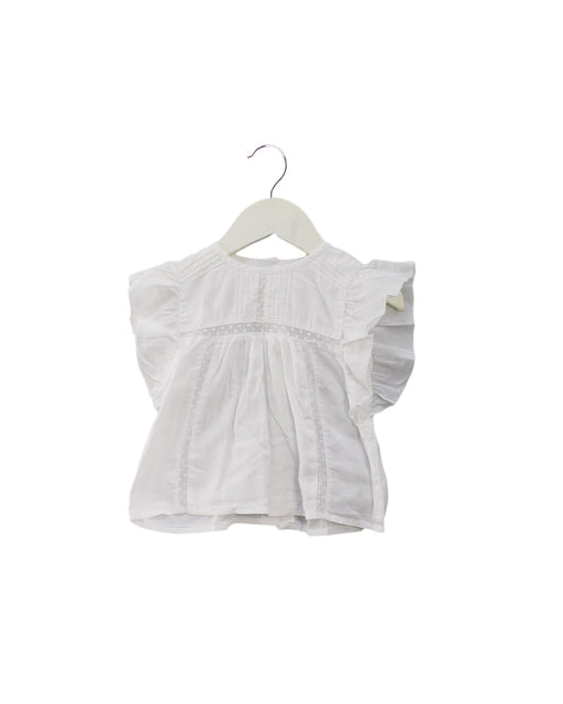 A Ivory Short Sleeve Tops from Louis Louise in size 6-12M for girl. (Front View)