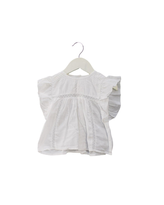 A Ivory Short Sleeve Tops from Louis Louise in size 6-12M for girl. (Front View)