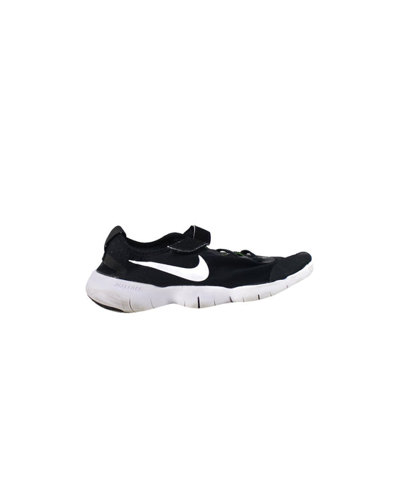 A Black Sneakers from Nike in size 10Y for boy. (Back View)