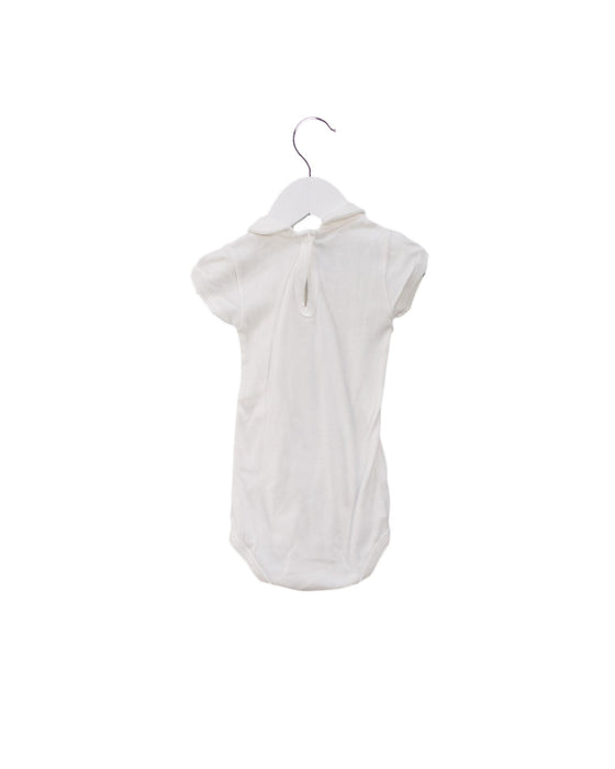 A White Short Sleeve Bodysuits from Petit Bateau in size 6-12M for girl. (Back View)