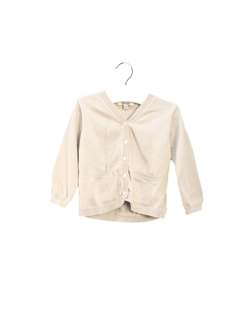 A Ivory Cardigans from Ovale in size 6-12M for girl. (Front View)