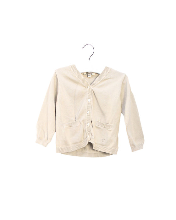 A Ivory Cardigans from Ovale in size 6-12M for girl. (Front View)