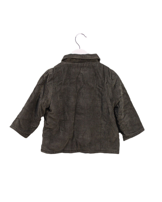 A Green Lightweight Jackets from Boden in size 12-18M for girl. (Back View)