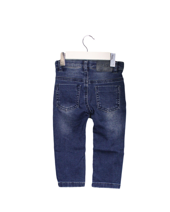 A Blue Jeans from 3Pommes in size 6-12M for boy. (Back View)