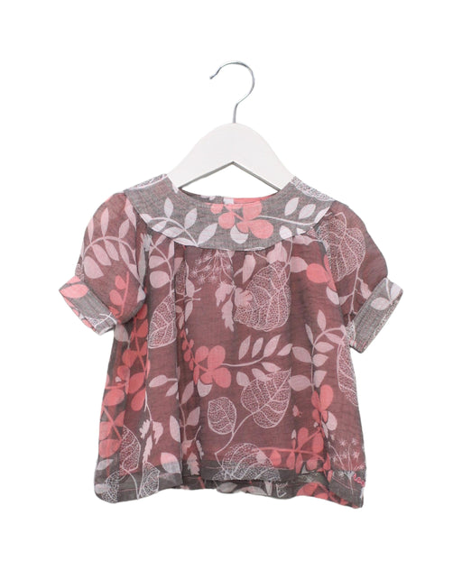 A Pink Short Sleeve Tops from Roots in size 6-12M for girl. (Front View)