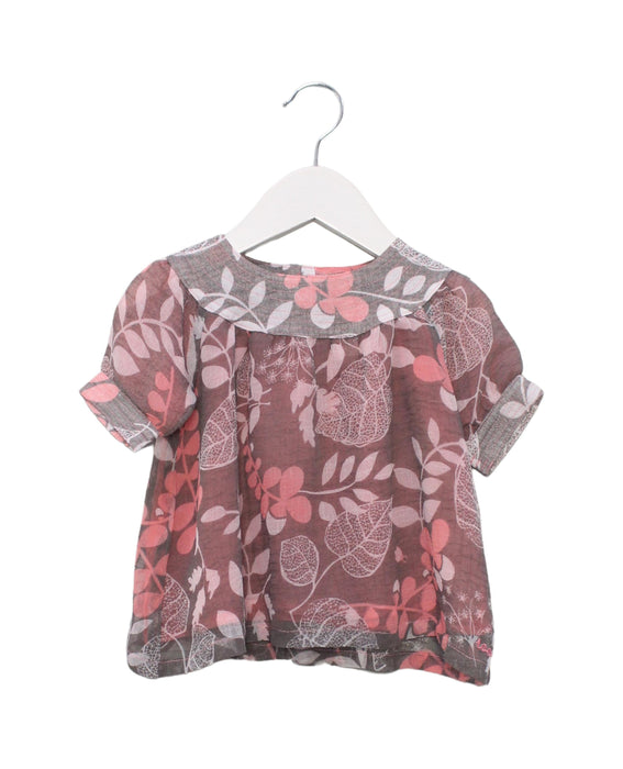 A Pink Short Sleeve Tops from Roots in size 6-12M for girl. (Front View)