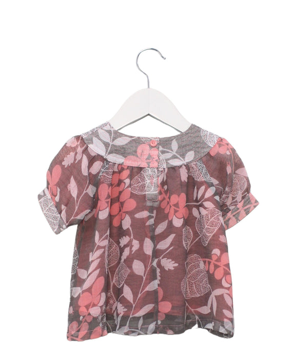 A Pink Short Sleeve Tops from Roots in size 6-12M for girl. (Back View)