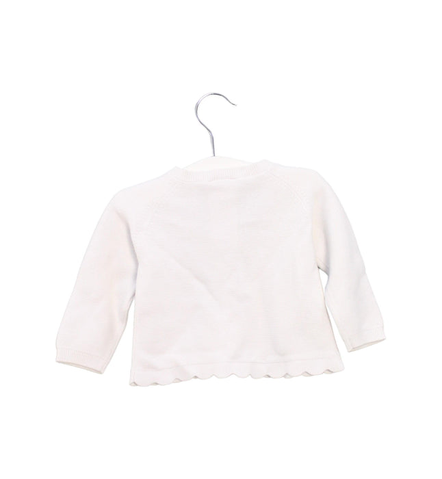 A White Cardigans from Jacadi in size 3-6M for girl. (Back View)