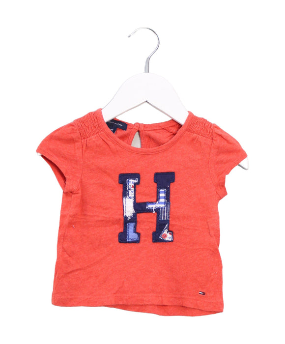 A Orange Short Sleeve T Shirts from Tommy Hilfiger in size 6-12M for girl. (Front View)