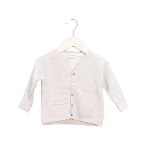 A White Cardigans from Les Enfantines in size 6-12M for neutral. (Front View)