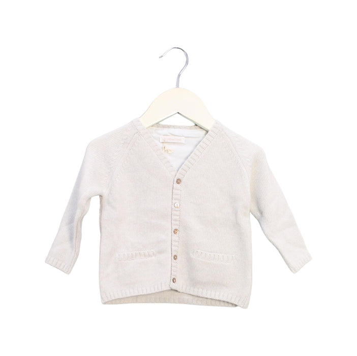 A White Cardigans from Les Enfantines in size 6-12M for neutral. (Front View)