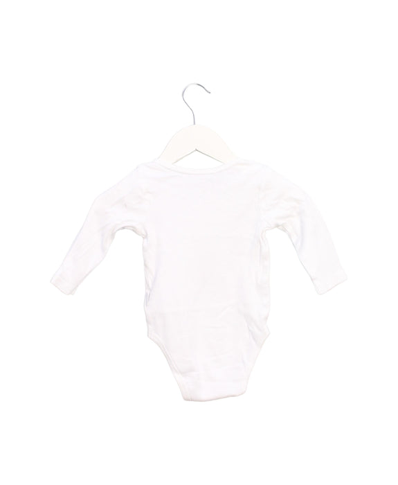 A White Long Sleeve Bodysuits from Purebaby in size 6-12M for girl. (Back View)
