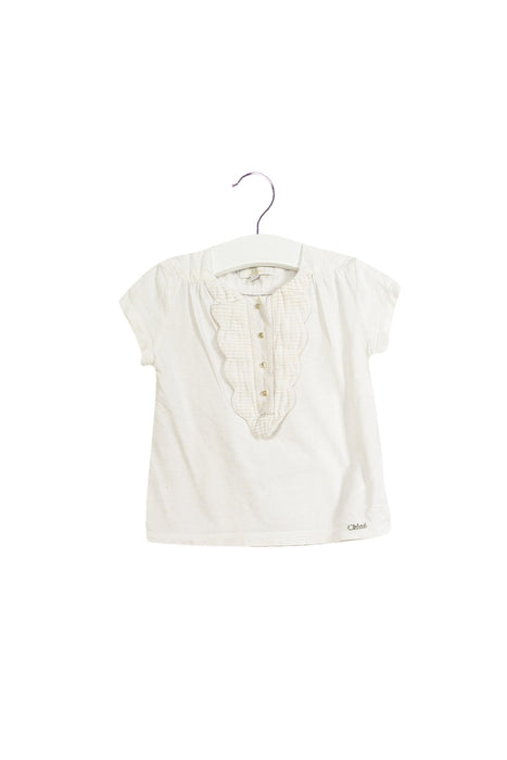 A White Short Sleeve Tops from Chloe in size 2T for girl. (Front View)
