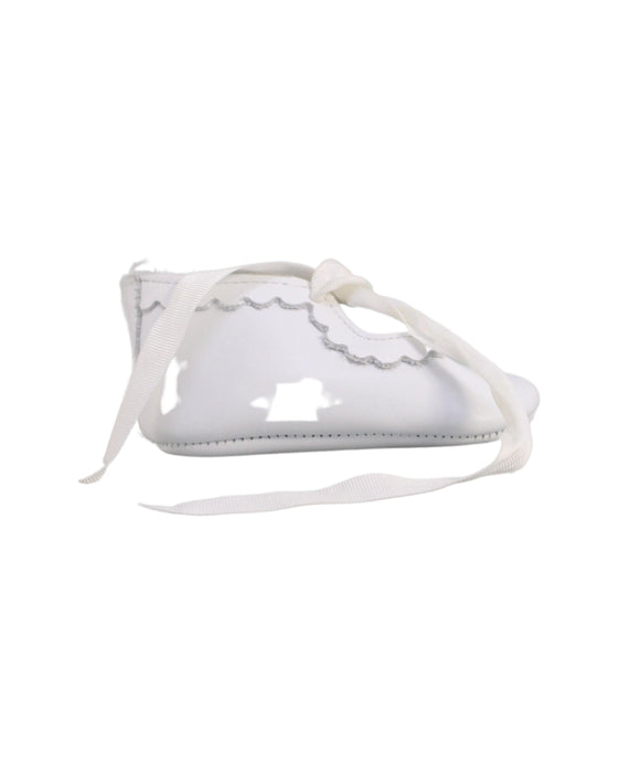 A White Flats from Jacadi in size 6-12M for girl. (Back View)