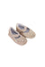 A Gold Flats from Monsoon in size 6-12M for girl. (Front View)