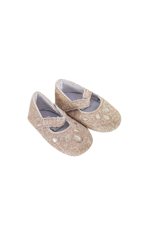 A Gold Flats from Monsoon in size 6-12M for girl. (Front View)