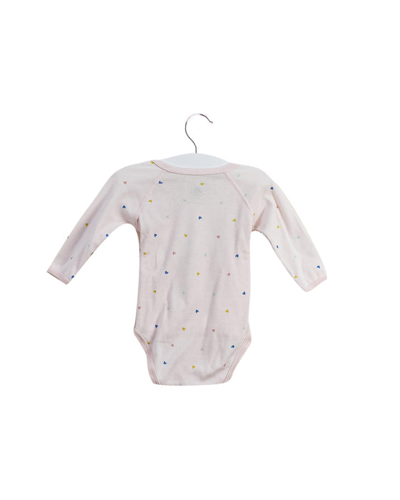 A Pink Long Sleeve Bodysuits from Petit Bateau in size 3-6M for girl. (Back View)