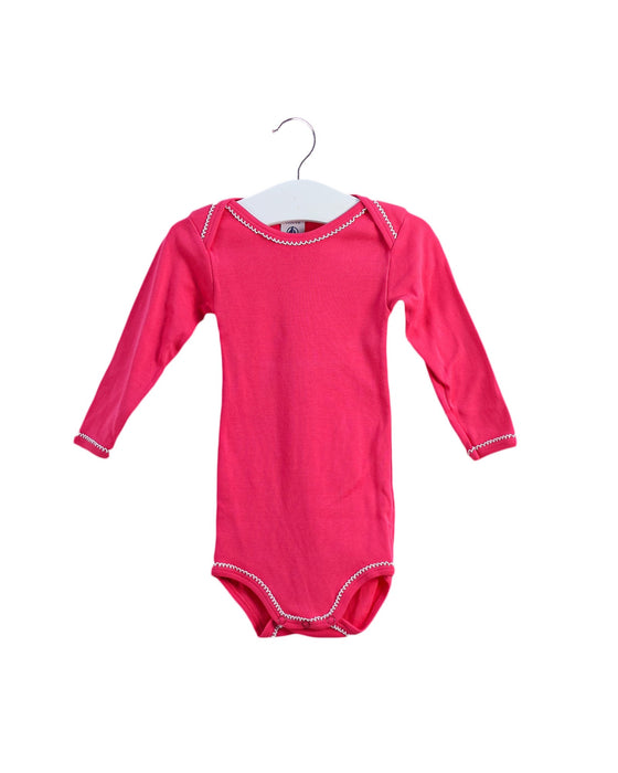 A Pink Long Sleeve Bodysuits from Petit Bateau in size 3-6M for girl. (Front View)