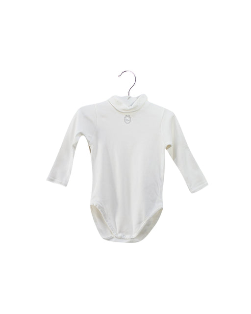 A White Long Sleeve Bodysuits from Dior in size 3-6M for girl. (Front View)