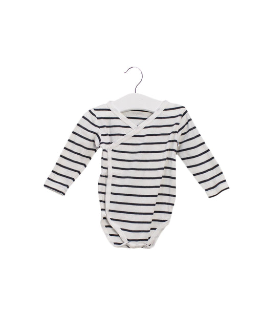A White Long Sleeve Bodysuits from Noukie's in size 3-6M for girl. (Front View)