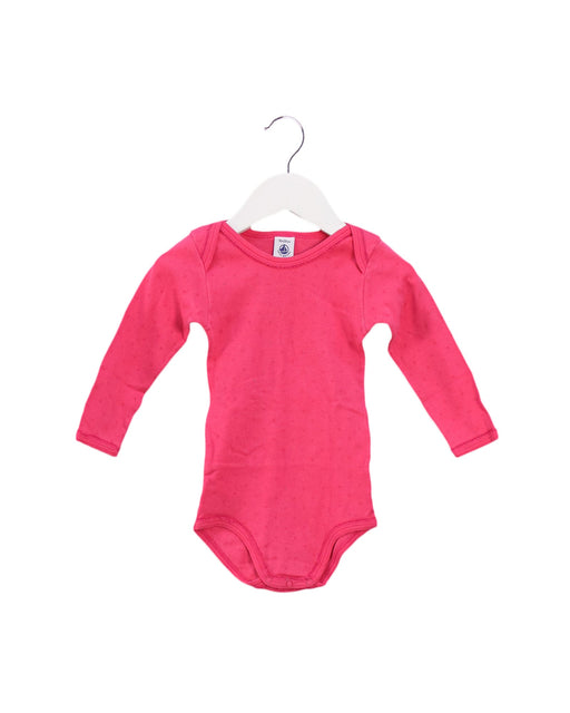 A Pink Long Sleeve Bodysuits from Petit Bateau in size 12-18M for girl. (Front View)