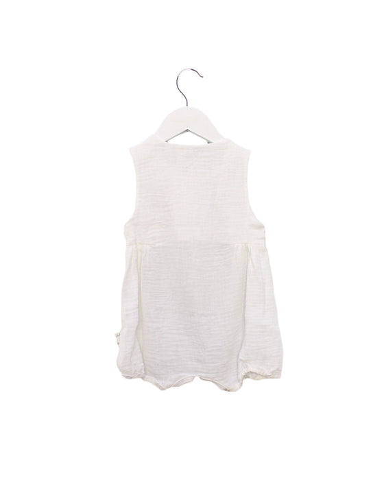 A White Sleeveless Bodysuits from Cotton Pigs in size 6-12M for girl. (Back View)