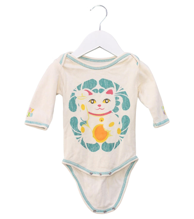 A Ivory Long Sleeve Bodysuits from Baby Hero in size 3-6M for girl. (Front View)
