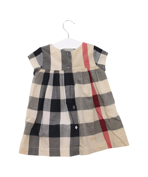A Beige Short Sleeve Dresses from Burberry in size 6-12M for girl. (Back View)