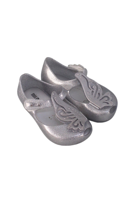 A Silver Flats from Mini Melissa in size 12-18M for girl. (Front View)