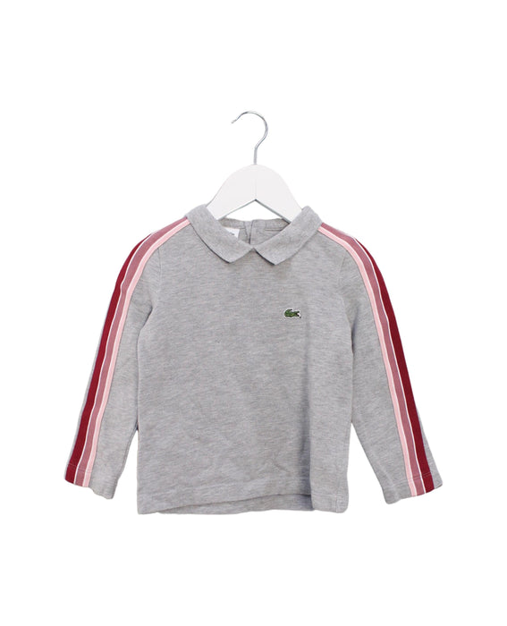A Grey Long Sleeve Tops from Lacoste in size 4T for girl. (Front View)