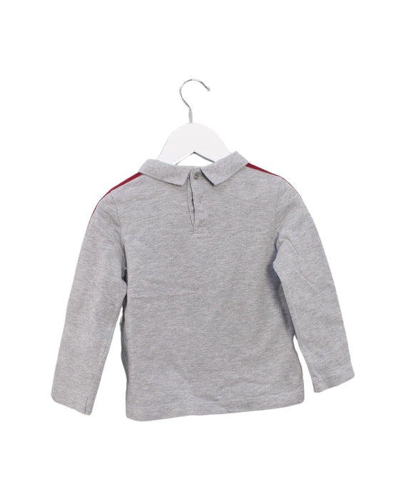 A Grey Long Sleeve Tops from Lacoste in size 4T for girl. (Back View)
