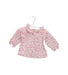 A Pink Long Sleeve Tops from CdeC in size 0-3M for girl. (Front View)