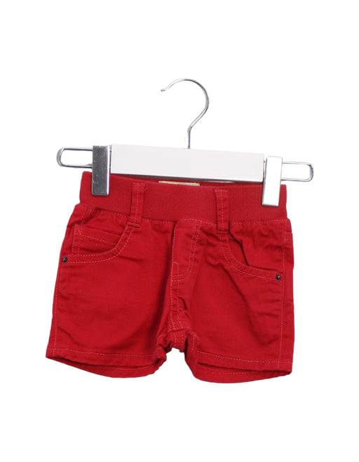 A Red Shorts from Levi's in size 3-6M for girl. (Front View)