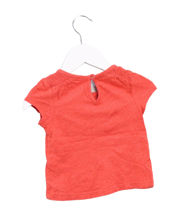 A Orange Short Sleeve T Shirts from Tommy Hilfiger in size 6-12M for girl. (Back View)