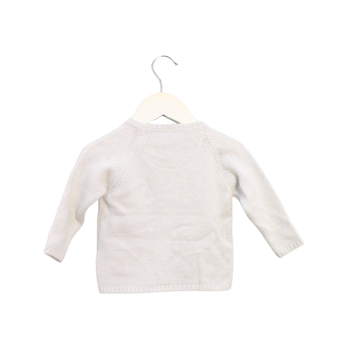 A White Cardigans from Les Enfantines in size 6-12M for neutral. (Back View)