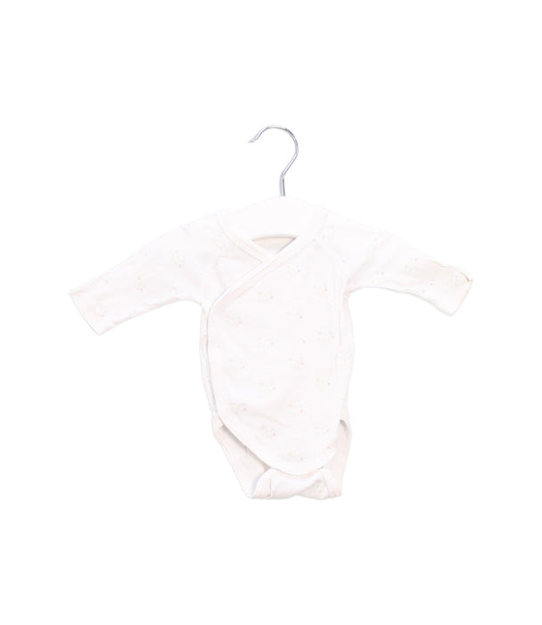 A White Long Sleeve Bodysuits from Petit Bateau in size Newborn for girl. (Front View)