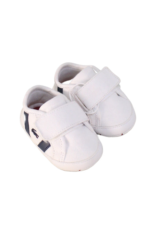 A White Sneakers from Lacoste in size Newborn for boy. (Front View)