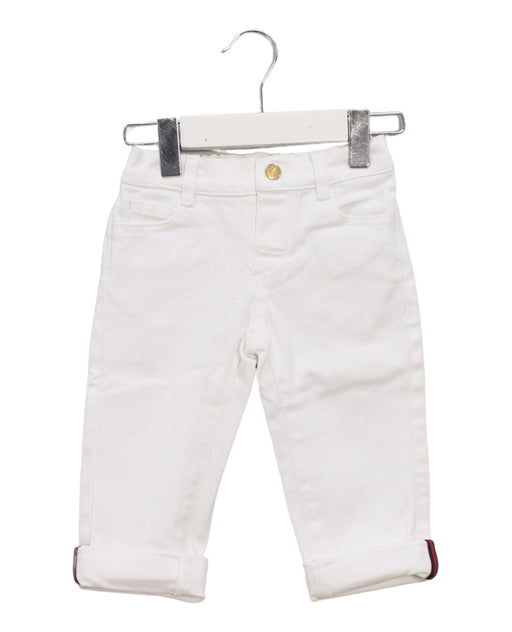 A White Jeans from Gucci in size 12-18M for boy. (Front View)