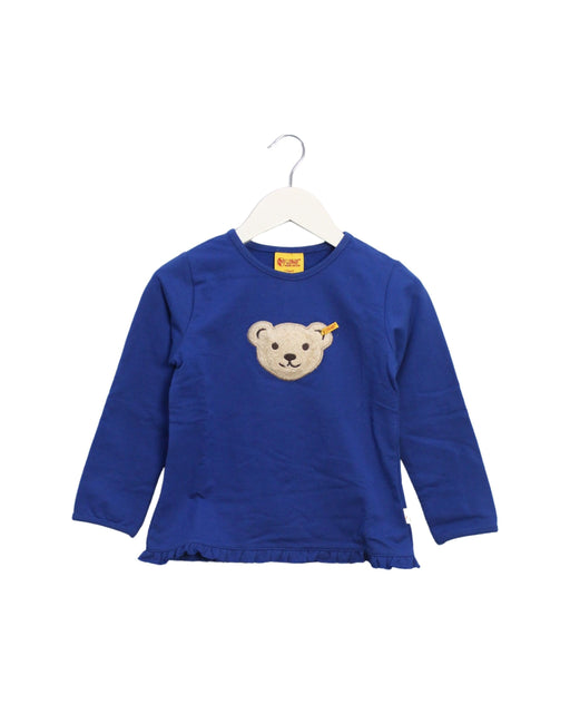 A Blue Long Sleeve Tops from Steiff in size 5T for girl. (Front View)