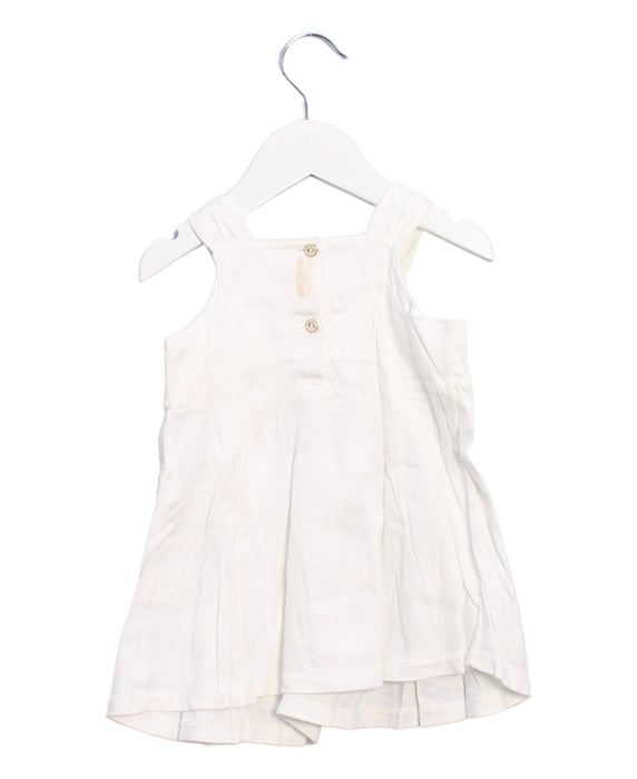 A Ivory Sleeveless Dresses from Absorba in size 6-12M for girl. (Back View)