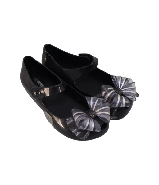 A Black Flats from Mini Melissa in size 6T for girl. (Front View)