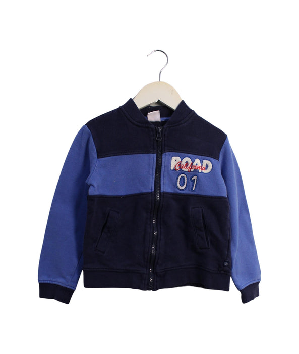 A Blue Lightweight Jackets from La Compagnie des Petits in size 4T for boy. (Front View)