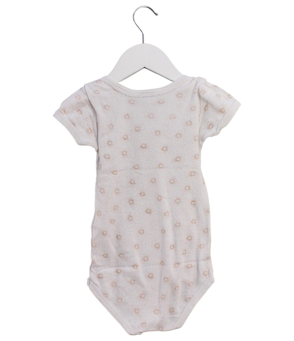 A Beige Short Sleeve Bodysuits from Petit Bateau in size 18-24M for girl. (Back View)
