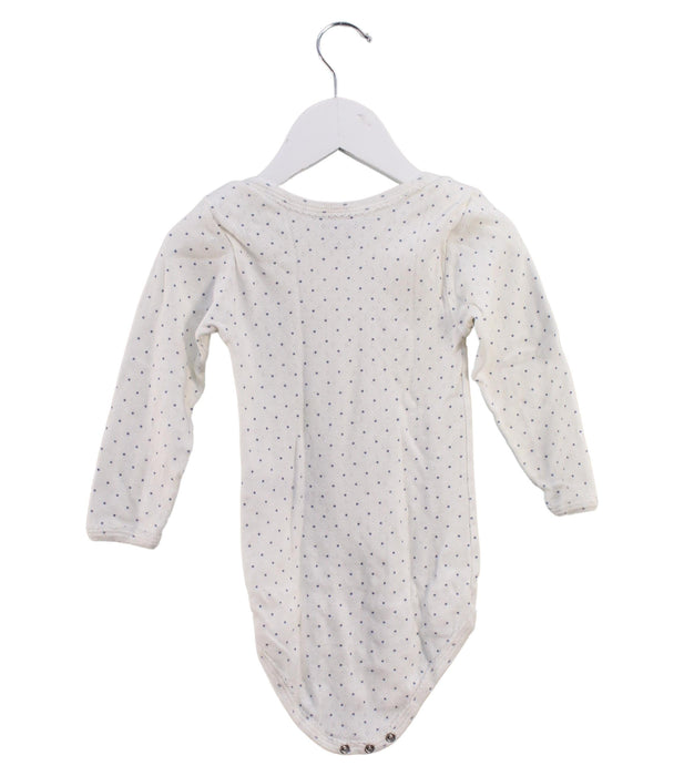 A White Long Sleeve Bodysuits from Petit Bateau in size 3T for girl. (Back View)